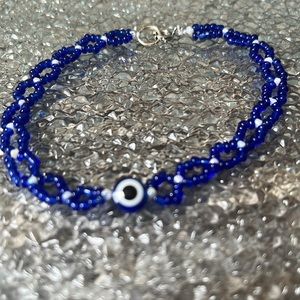 Blue and white beaded bracelet with blue evil eye 🧿